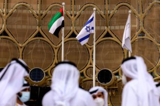 The flags of the UAE and Israel fly at the Dubai expo, in the gulf emirate [KARIM SAHIB/AFP via Getty Images]